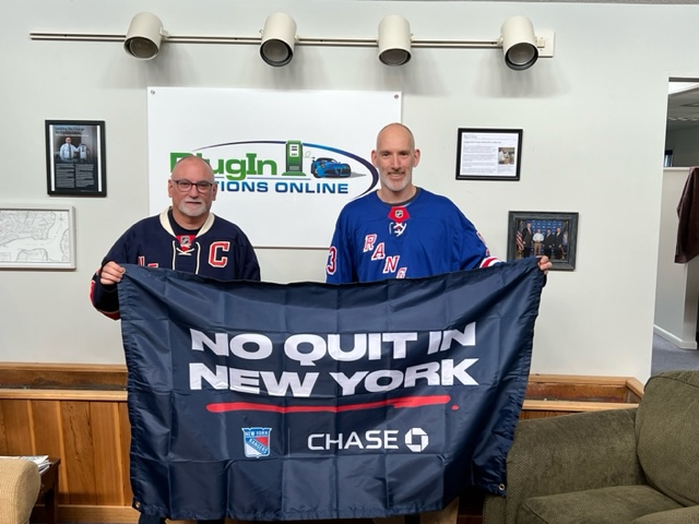John and Jesse at New York Rangers game being named a No Quit business